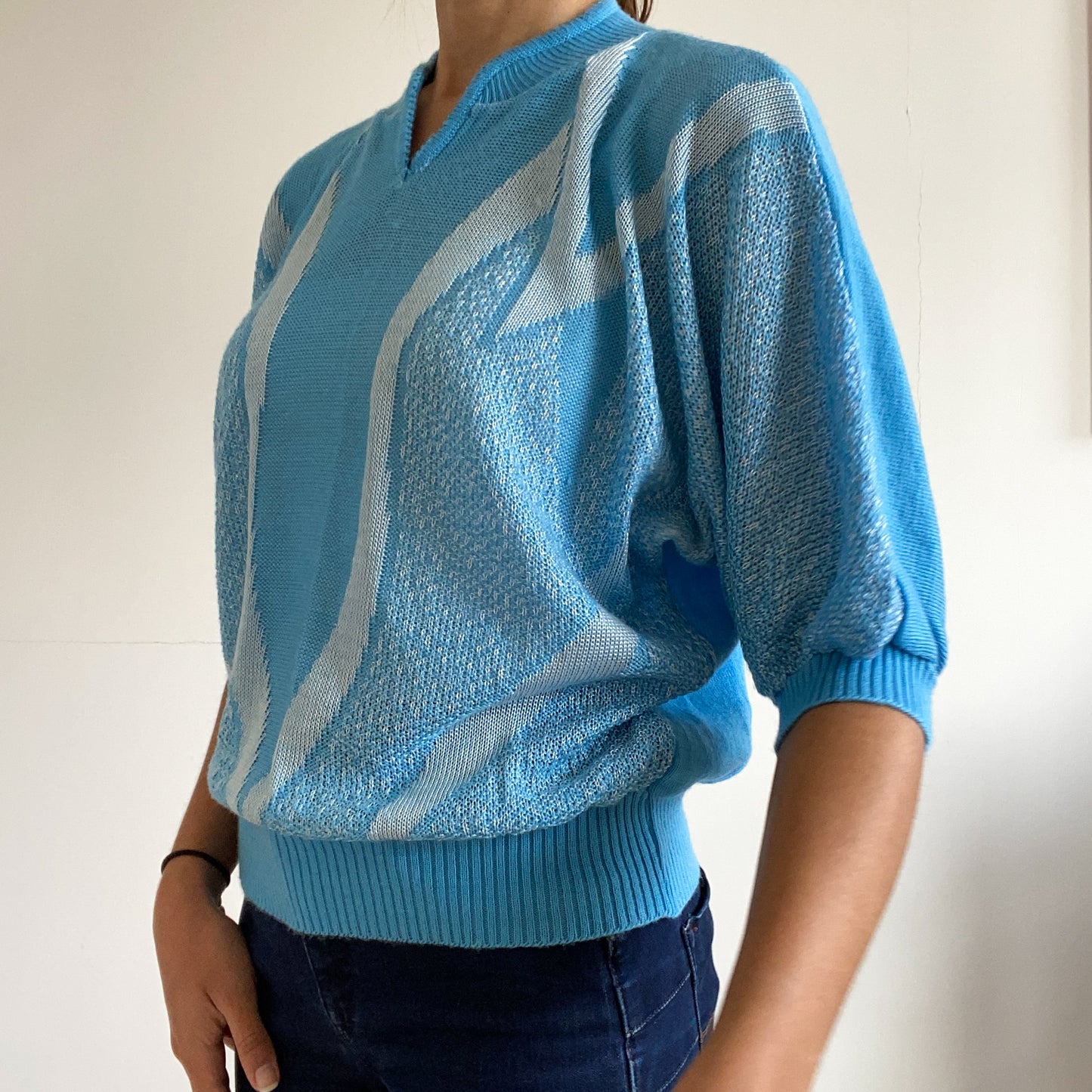 Blue short sleeve pullover sweater.