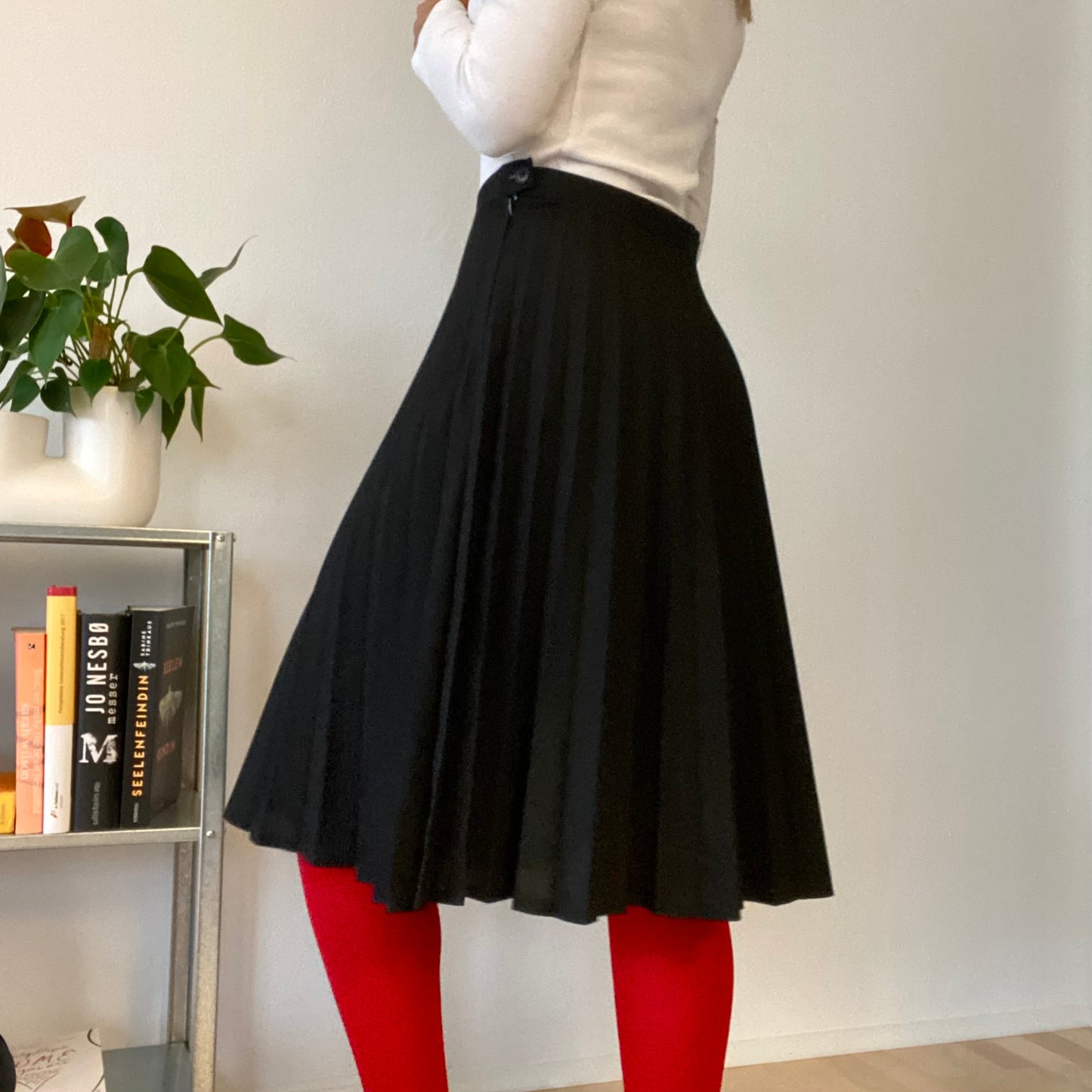 Knee length black pleaded skirt