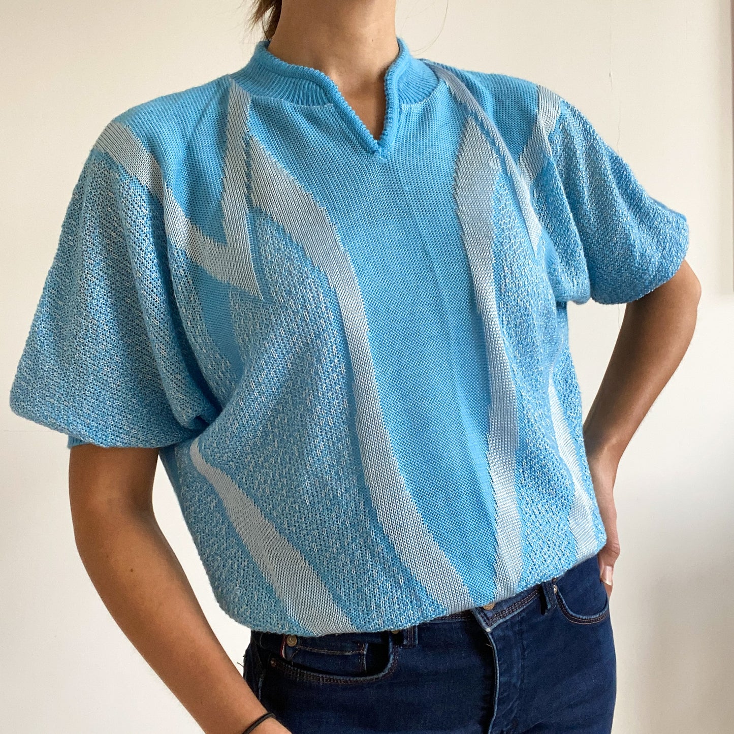 Blue short sleeve pullover sweater.