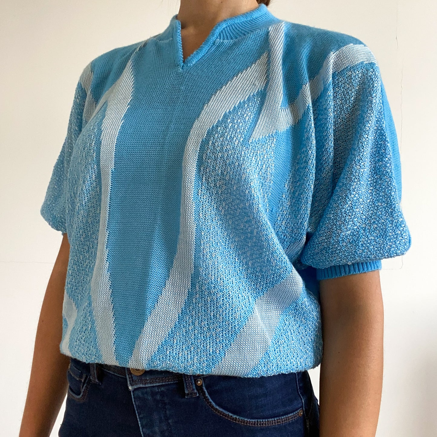 Blue short sleeve pullover sweater.