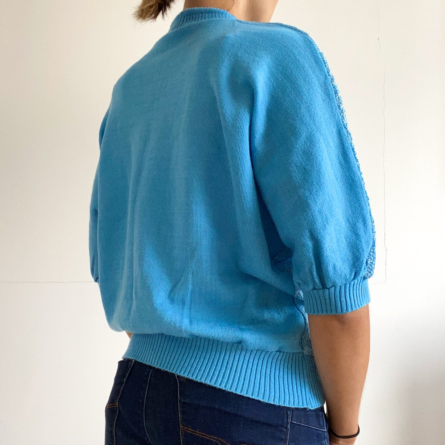Blue short sleeve pullover sweater.
