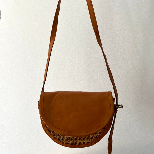 Tan leather half-moon crossbody bag