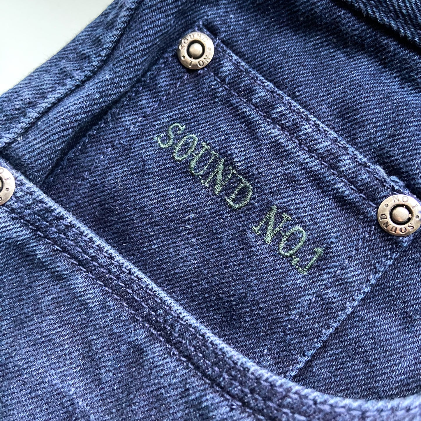 Dark blue trousers