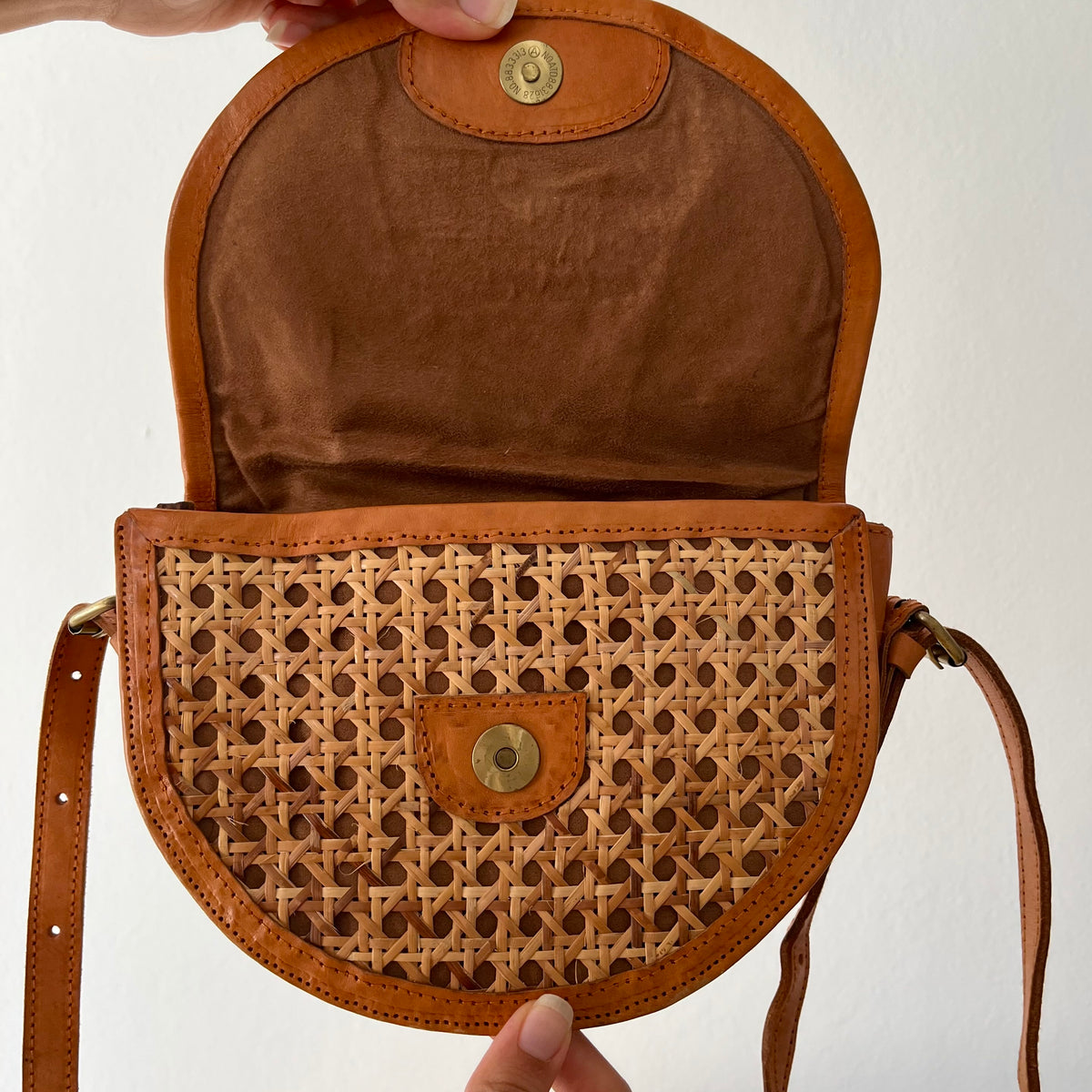 Tan leather half-moon crossbody bag